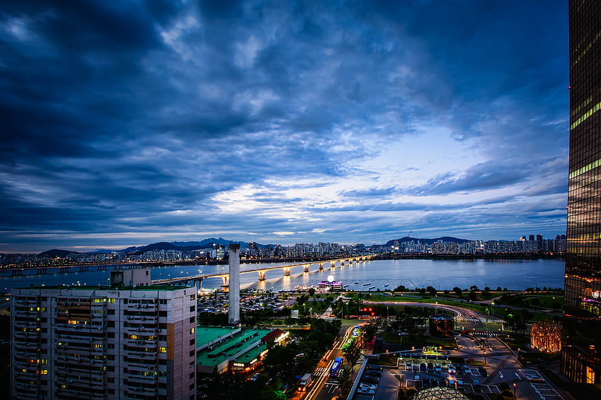 Seoul Cityscape at Dusk with Han River and Bridge