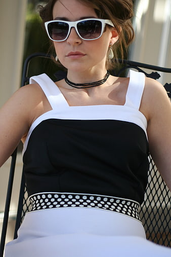 Stylish Woman in Black and White Dress with Sunglasses