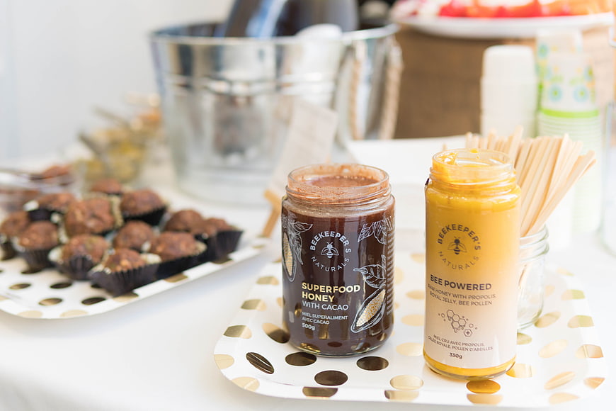 Beekeeper's Naturals Honey Jars on Polka Dot Plate