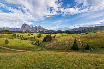 Panoramic Dolomites Landscape with Green Hills and Mountains