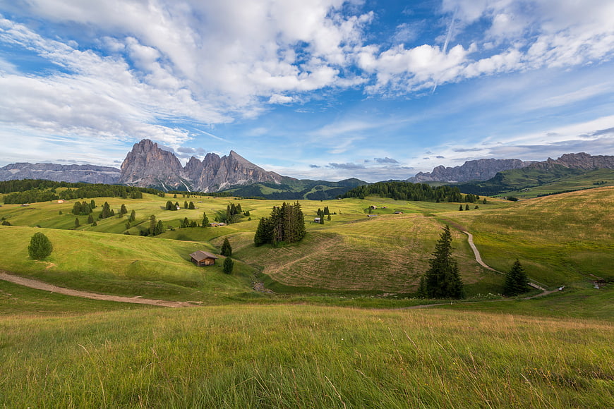 Panoramic Dolomites Landscape with Green Hills and Mountains