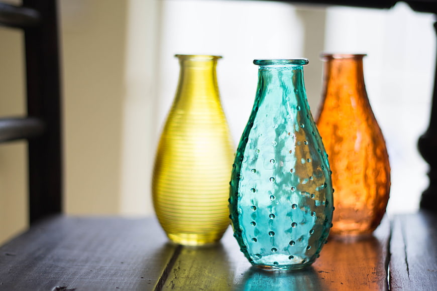 Colorful Textured Glass Vases on Wooden Shelf