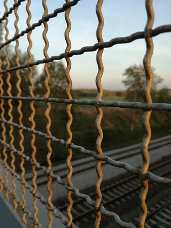 Close-up of Wavy Metal Grille on Railway Bridge