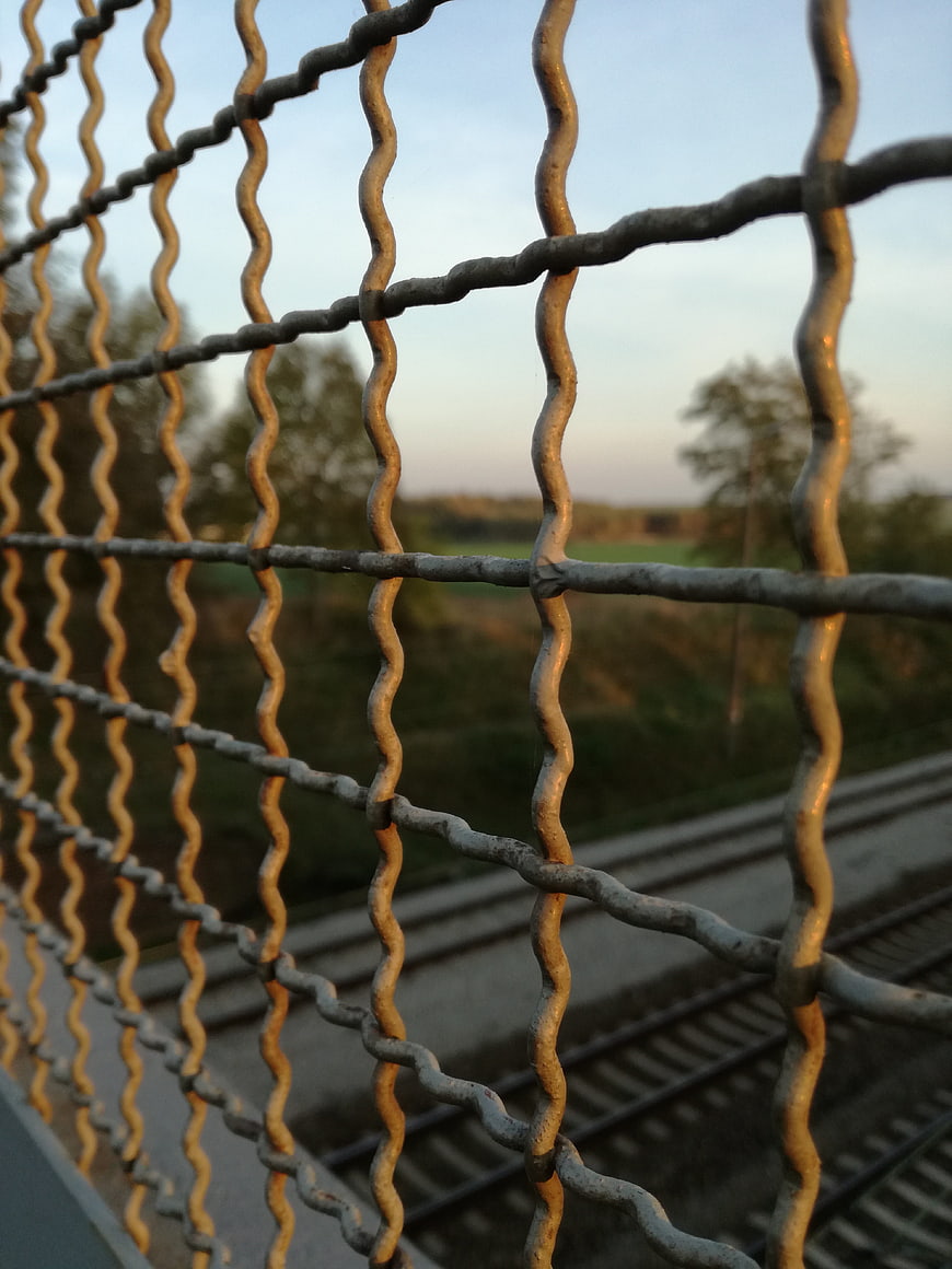 Close-up of Wavy Metal Grille on Railway Bridge