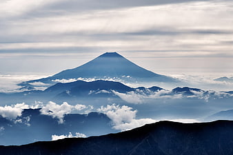 Majestic Mount Fuji Rising Above Clouds and Mountain Layers