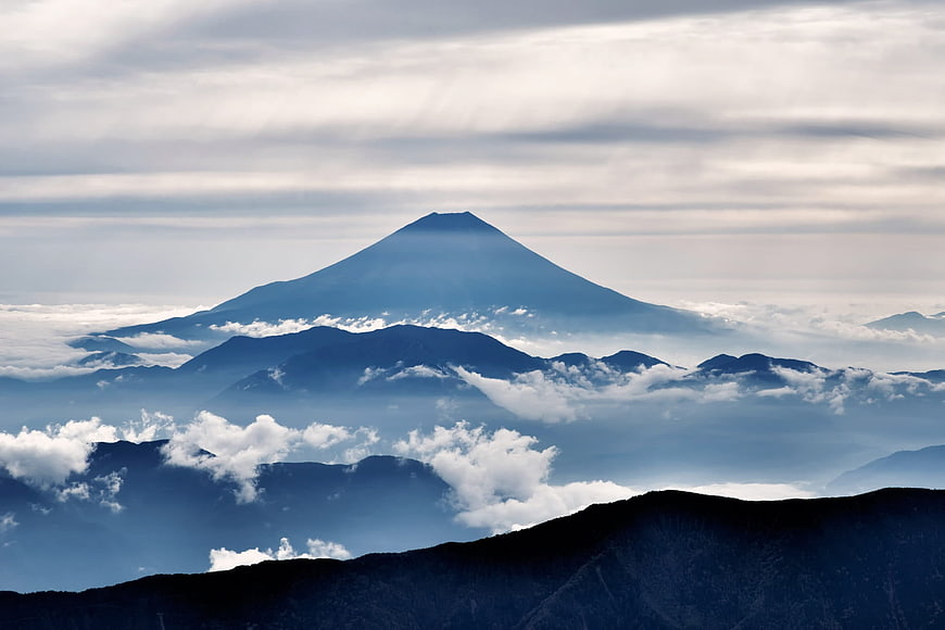 Majestic Mount Fuji Rising Above Clouds and Mountain Layers