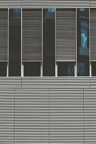Modern building facade with horizontal slats and glass windows