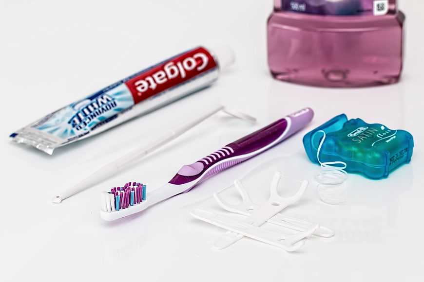 Oral Hygiene Essentials Including Toothbrush, Toothpaste, Floss, and Mouthwash