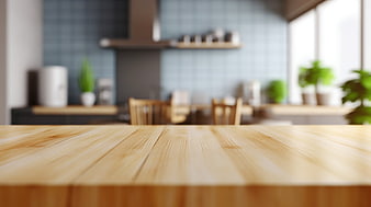 Empty wooden table surface with blurred modern kitchen background