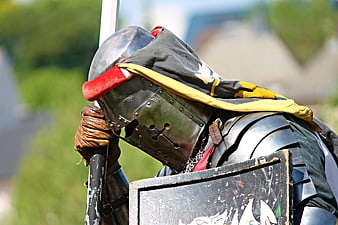 Medieval Knight in Full Plate Armor Holding Lance and Shield