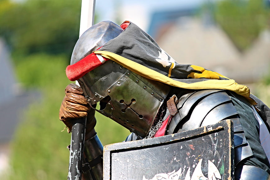 Medieval Knight in Full Plate Armor Holding Lance and Shield