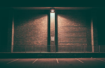 Symmetrical Brick Wall with Single Light in Parking Garage