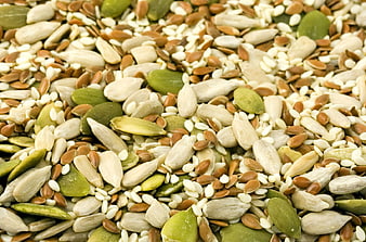 Close-up of mixed raw seeds including pumpkin, sunflower, and sesame