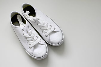 White Canvas Sneakers on Light Gray Background