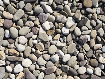 Close-up texture of smooth multicolored river stones
