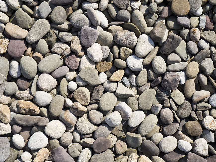 Close-up texture of smooth multicolored river stones
