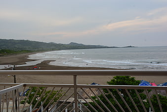 Beach view from balcony railing in Montepio, Veracruz