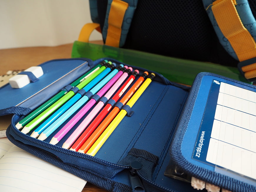 Colorful Pencils In Blue Pencil Case With School Backpack