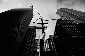 Low angle black and white skyscrapers and street lamp