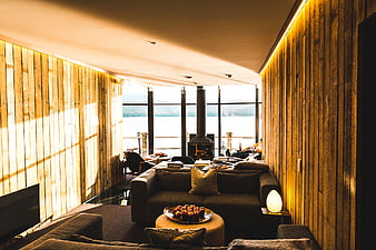 Modern wooden interior with lake view and cozy living room