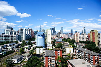 Moscow City Skyline with Industrial Foreground and Blue Sky
