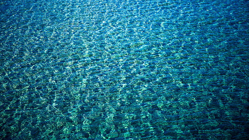 Crystal Clear Blue Ocean Water Surface Texture
