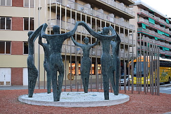 Bronze Sculpture of Figures in Urban Plaza