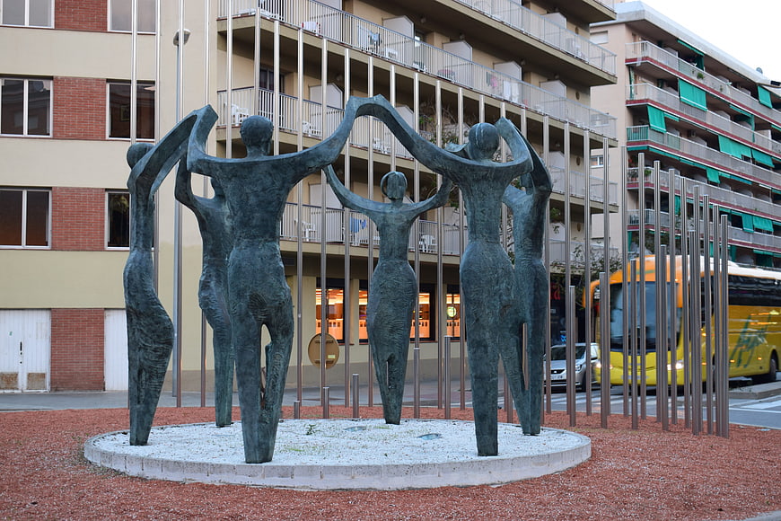 Bronze Sculpture of Figures in Urban Plaza