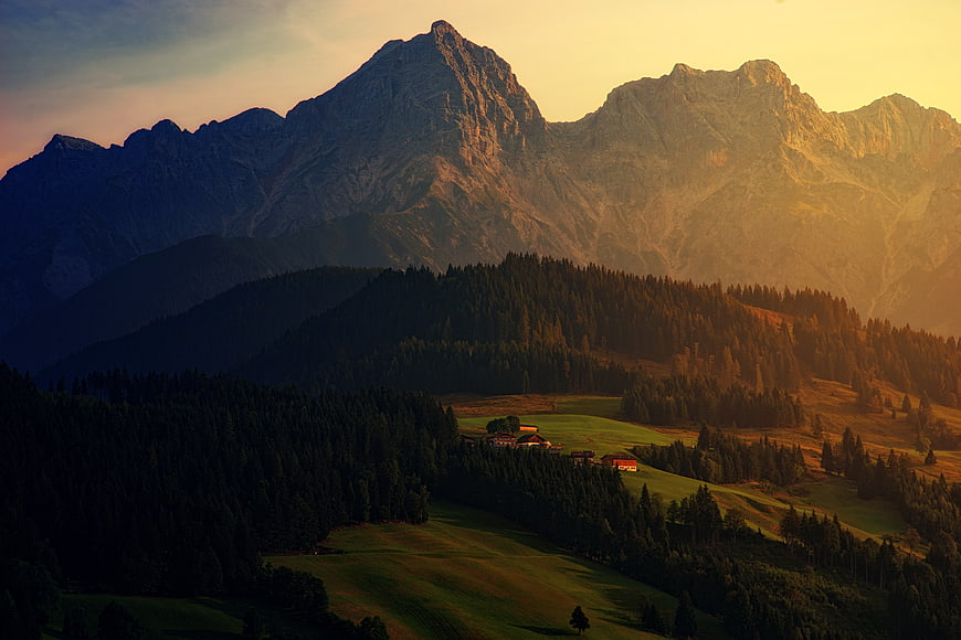 Majestic Mountain Landscape at Golden Hour with Forest and Valley
