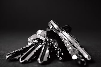 Close-up of silver keys on black background