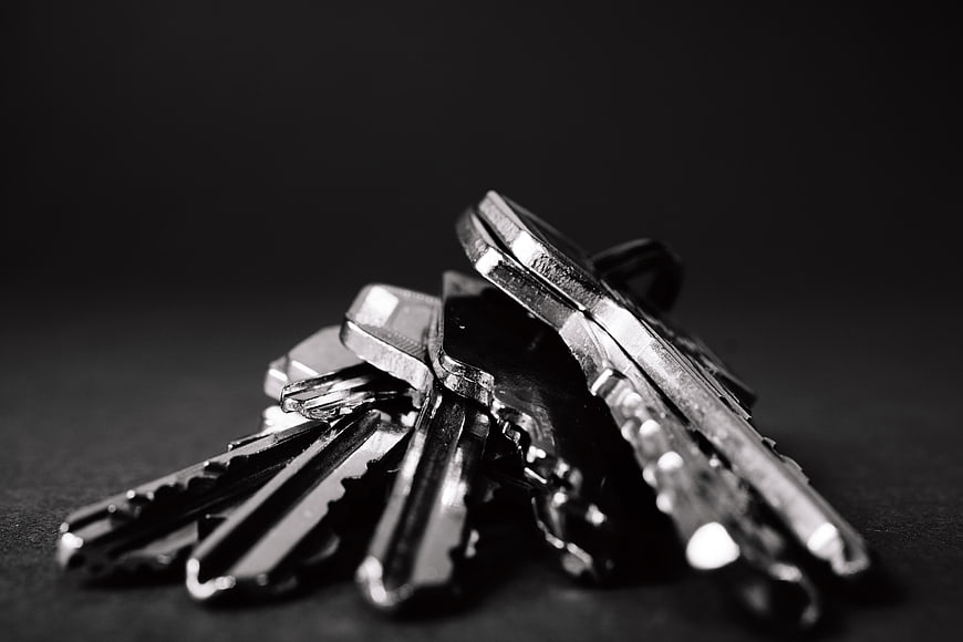 Close-up of silver keys on black background
