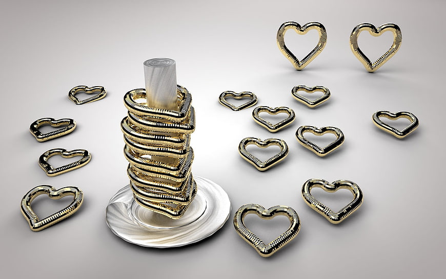 Stack of Gold Heart Rings on White Marble Pedestal