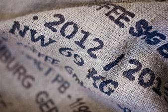 Close-up of burlap sack with stamped text and texture