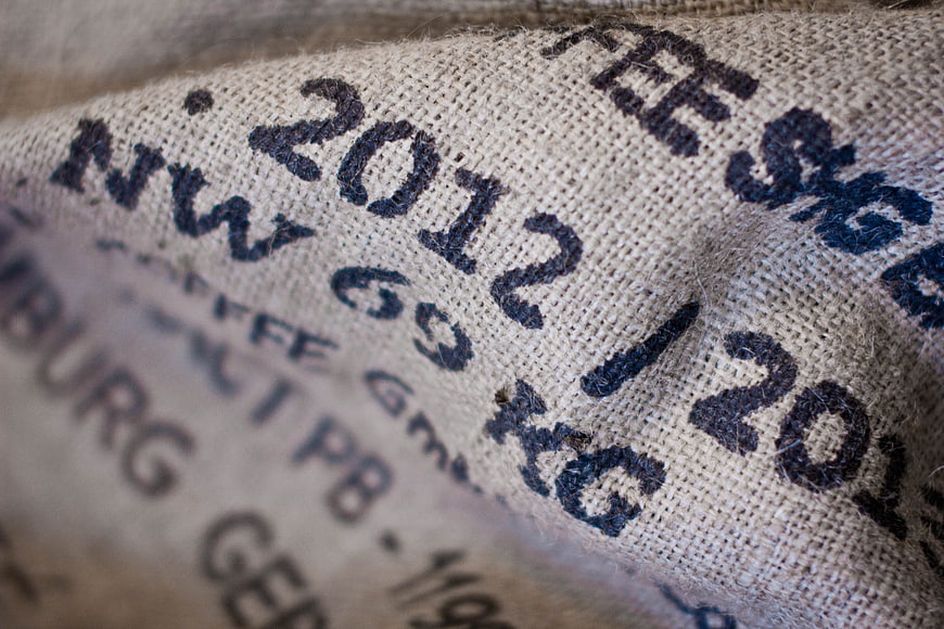 Close-up of burlap sack with stamped text and texture