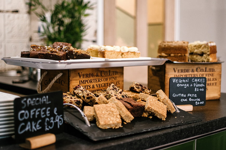Rustic Bakery Display with Brownies, Cakes, and Chalkboard Signs