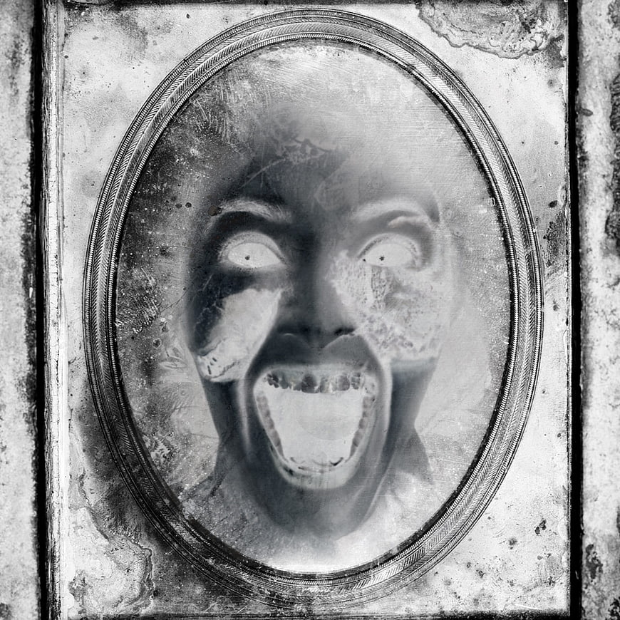 Distressed vintage oval portrait of a screaming face with grunge texture