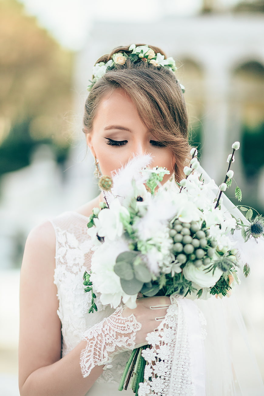 Bride with Floral Crown Holding White Bouquet