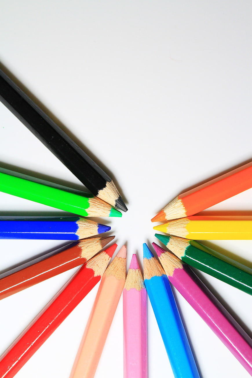 Colorful Pencils Arranged in Circle on White Background