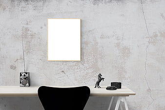 Minimalist Poster Mockup on Concrete Wall with Desk