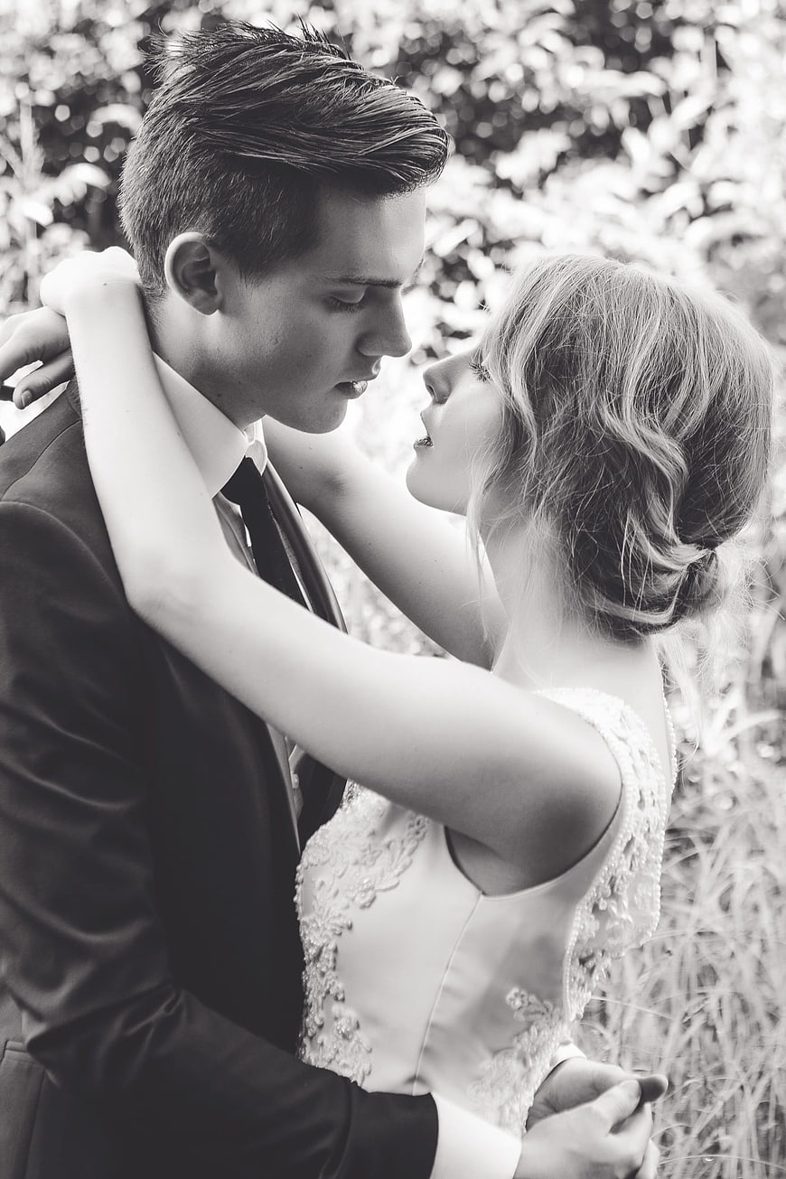 Romantic Black and White Portrait of Bride and Groom Embracing