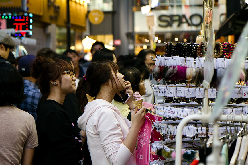 Young Women Shopping At Night Market In Myeongdong Seoul