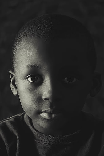 Dramatic Black and White Portrait of a Young African Boy