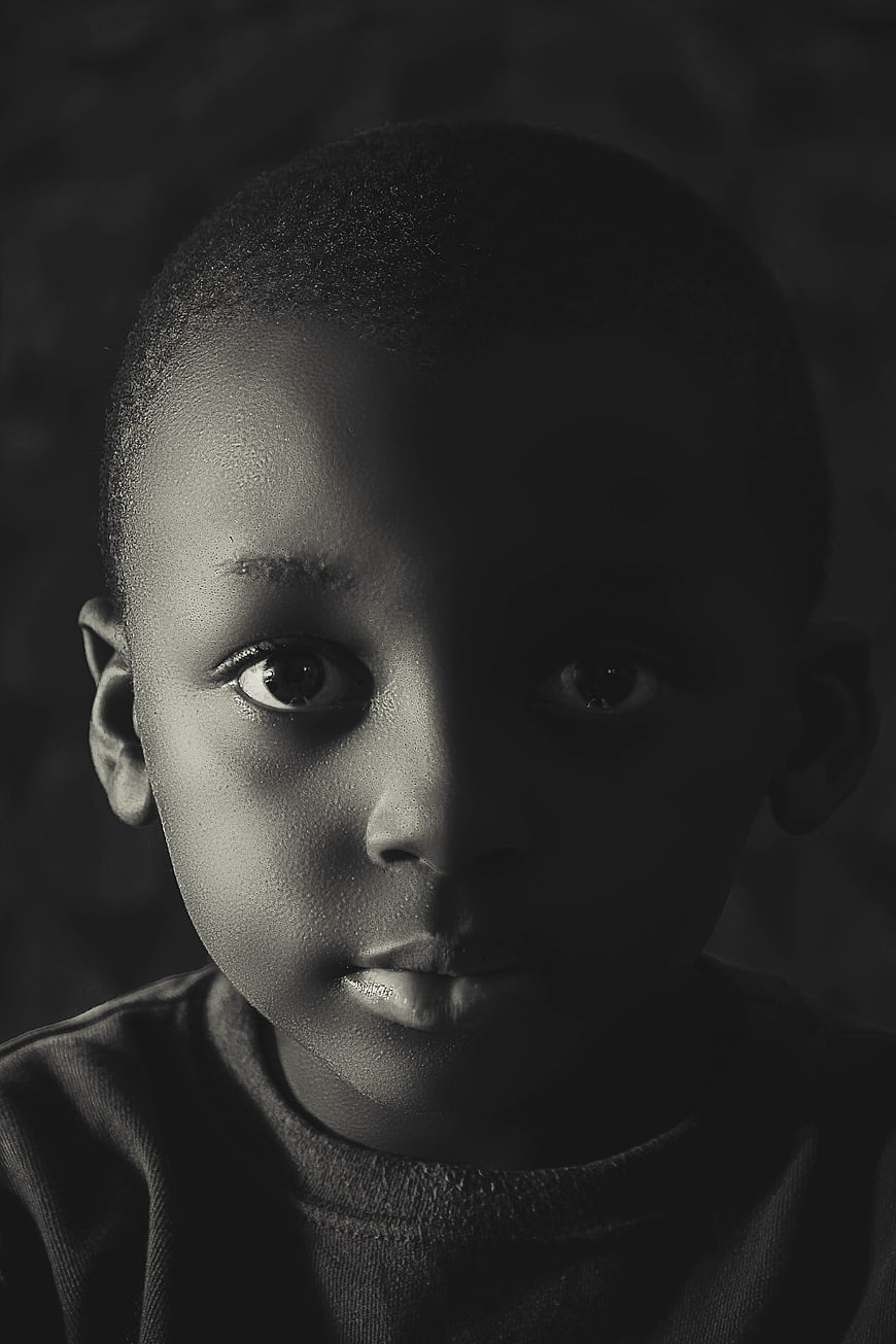Dramatic Black and White Portrait of a Young African Boy