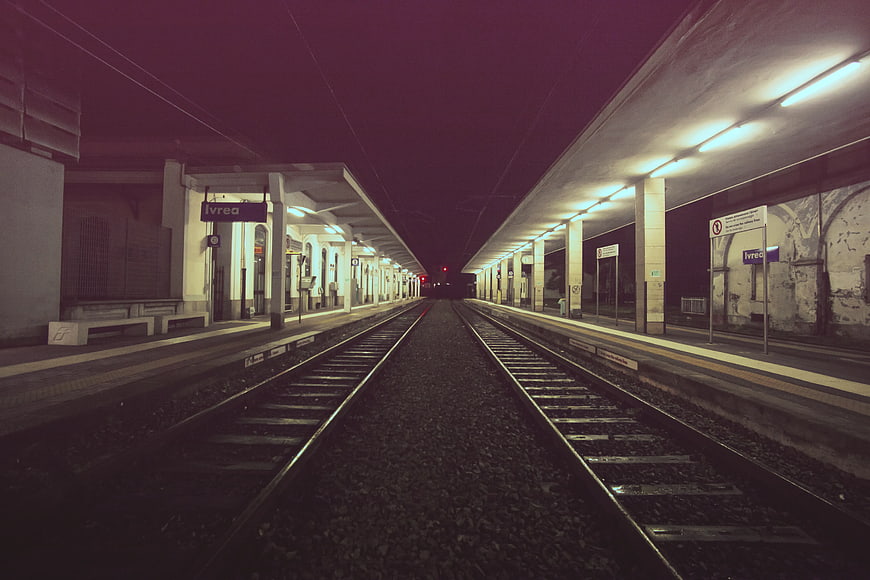 Empty Train Station Platform at Night with Leading Lines