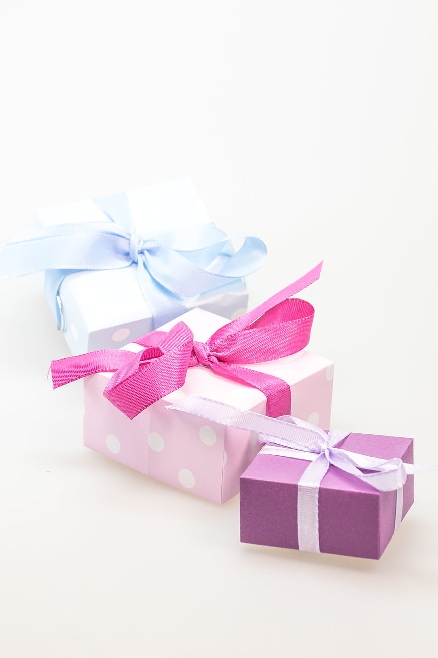 Pastel Gift Boxes with Ribbons on White Background