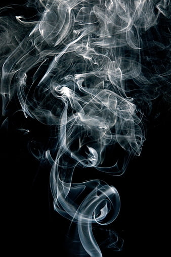 Abstract White Smoke Swirls on Black Background