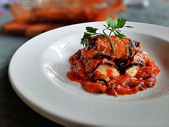 Eggplant Cannelloni with Tomato Sauce and Parsley Garnish