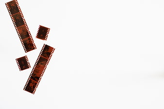 Vintage film strips on white background with copyspace