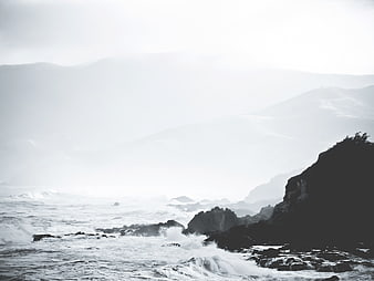 Dramatic Black and White Coastal Landscape with Crashing Waves