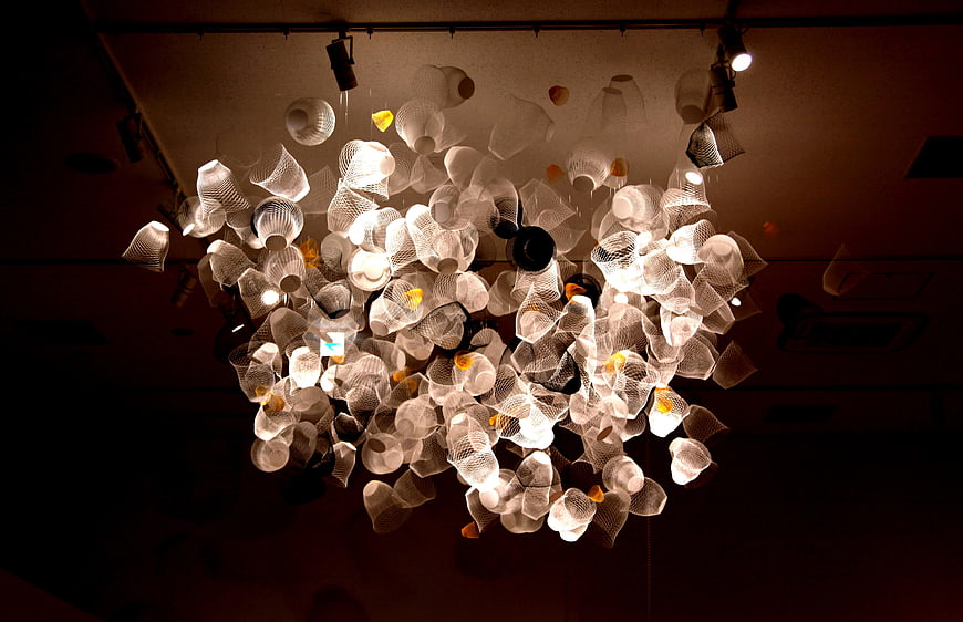 Modern Chandelier with White Mesh Shells and Warm Lighting